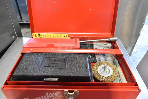 Craftsman 3/8 Inch Electric Drill in a Milwaukee red metal tool box. Includes accessories, labeled "Made in U.S.A."