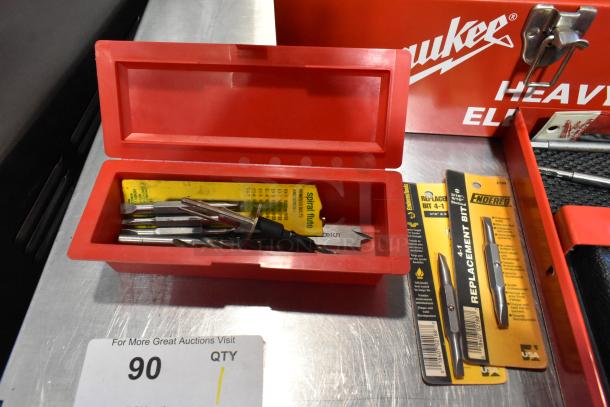 Craftsman 3/8 inch electric drill with accessories in a red Milwaukee metal tool box, includes replacement bits.
