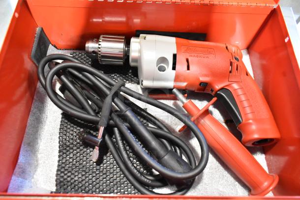 Milwaukee Electric Holeshooter in red metal tool box, includes power cord and side handle, excellent condition.