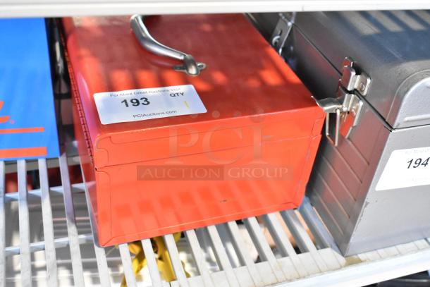 Milwaukee Electric Holeshooter in red metal tool box with handle, item 193. Auction label visible.