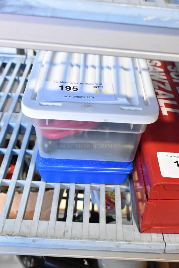 Two plastic bins with contents, including a hole saw kit, labeled "195 QTY x2" on shelving.