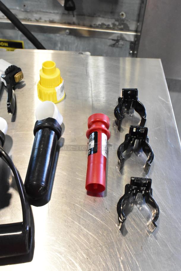 2 poly bins with contents including a hole saw kit. Items feature various sizes and materials. Condition: used.