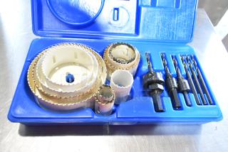 Hole saw kit in blue case with multiple sizes, drill bits, and attachments. Good condition. Part of two poly bin auction lot.