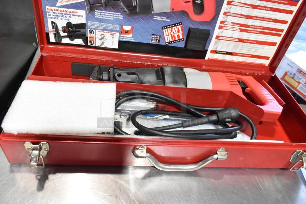 Milwaukee Electric Sawzall in red tool box, excellent condition, features Quik-Lok Blade Clamp, includes power cord and instructions.