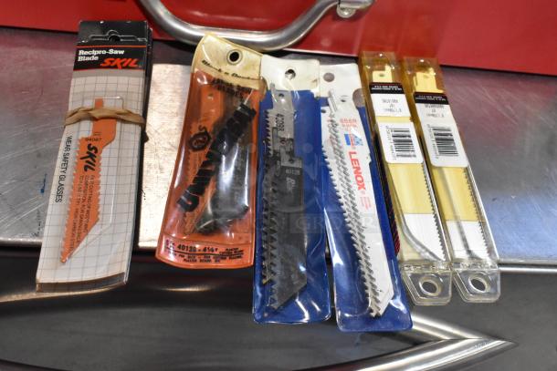 Multiple saw blades in packaging featuring brands like Skil, Lenox, and Universal, displayed on a metal surface.