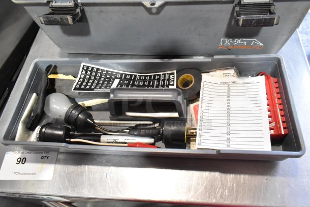 Gray poly tool box with various contents including a Craftsman autoranging multimeter, wiring tools, and a directory label.