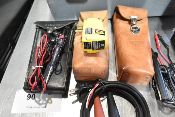 Gray poly tool box contents include Craftsman autoranging multimeter, Amprobe tester, and tan leather cases with tools.