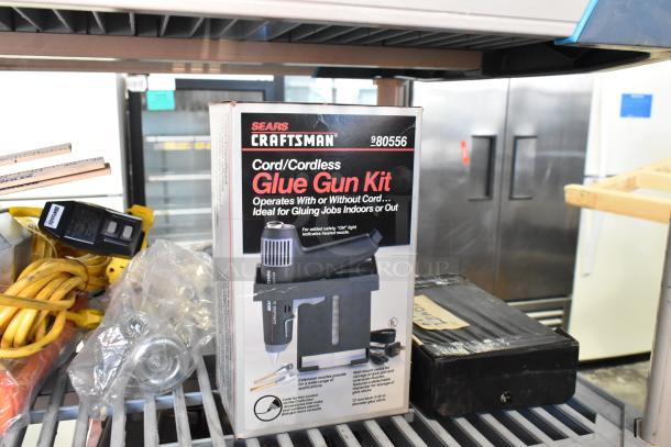 Sears Craftsman Cord/Cordless Glue Gun Kit in box, model #980556. Includes flashlight, worklight, cables. Appears new.