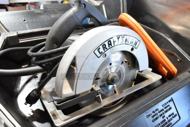 Craftsman 7-1/4" Circular Saw in tool box, 120 volts, 1 phase, visible Craftsman logo, used condition.