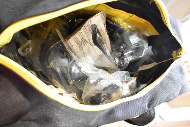 Black and yellow bag containing kneepads and dusting brush, plastic packaging visible.