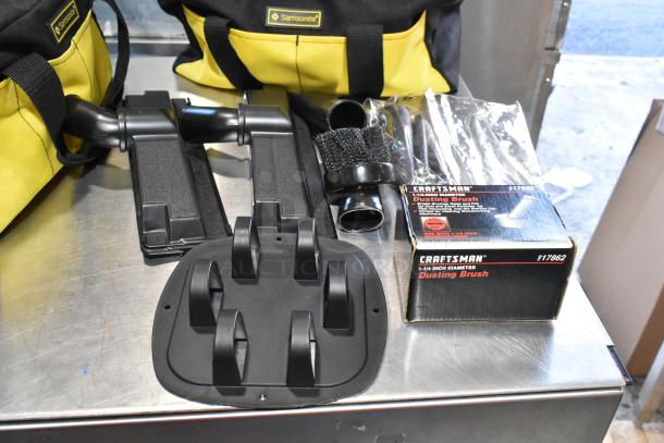 Three black and yellow Samsonite bags with Craftsman dusting brush and kneepads, new condition, included.