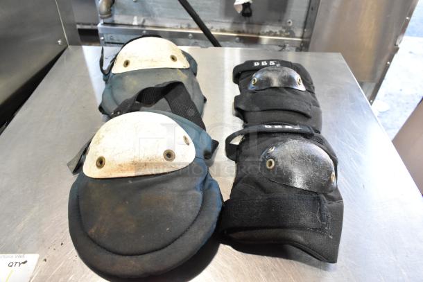 Black and yellow bags with kneepads visible; some are DBS brand. Includes dusting brush. Used condition. Auction set.