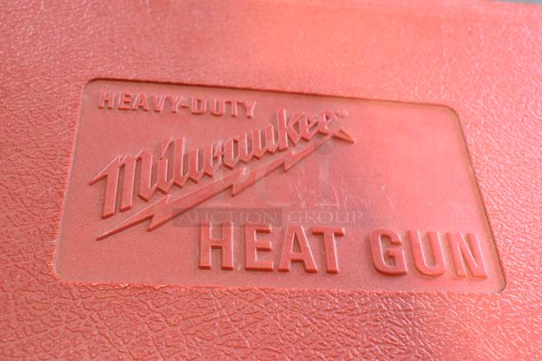 Milwaukee Electric Heat Gun in red hard case, labeled "Heavy-Duty Milwaukee Heat Gun," 120 Volts, 1 Phase.