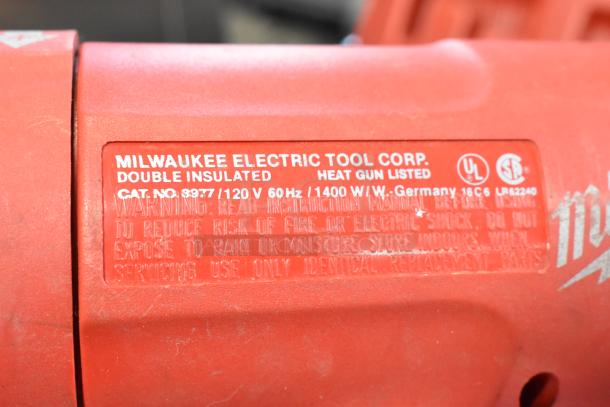 Milwaukee Electric Heat Gun, model 8977, 120V, in good condition. Red body with clear label, in hard case.