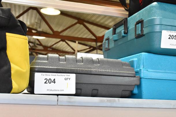 Skil 4650 Auto-scroll Jig Saw in a black hard case, 120 Volts, 1 Phase. Auction label with "204" visible.