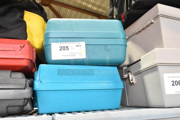 Makita cordless saw and Bosch sander in hard cases, both tools in good condition. Auction label: "For More Great Auctions Visit Pciauctions.com".