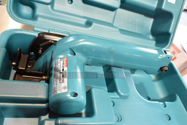 Makita 5090D cordless circular saw in hard case, good condition, visible label details.