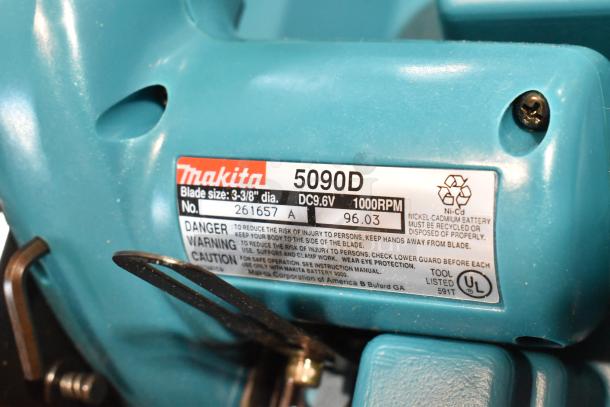 Makita 5090D cordless circular saw with 3-3/8" blade, showing model label. Battery: DC9.6V, RPM: 1000, tool listed.