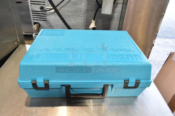 Blue Bosch hard case containing a Bosch 3283 DVS electric sander. Case is closed, labeled with Bosch logo.