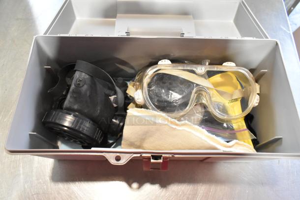 2 gray poly tool boxes with contents including a dust mask and safety goggles in good condition.