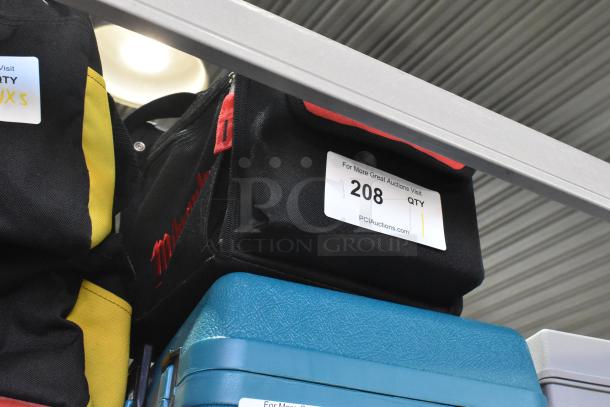 Milwaukee soft tool bag in black with red logo, visible label reading "For More Great Auctions Visit PCIauctions.com."