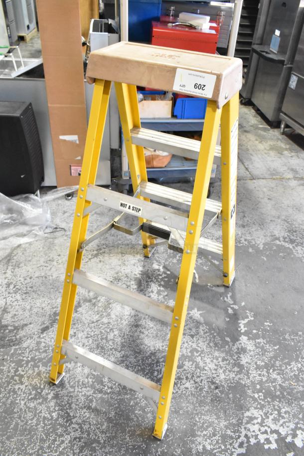 Bauer 300 Pound Capacity A Frame Ladder, yellow, aluminum steps, "NOT A STEP" label, auction tag "209".