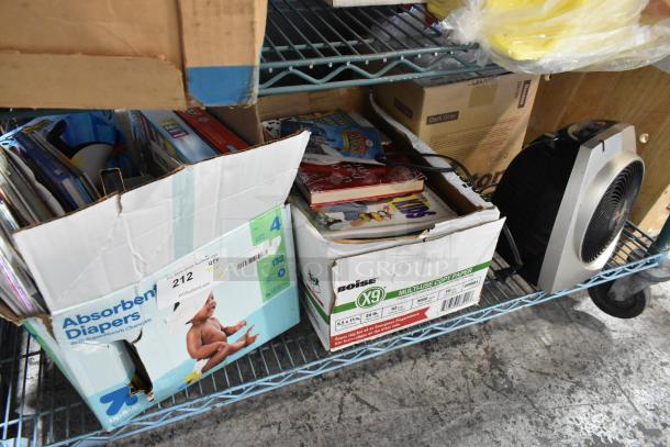 Boxed lot with Vornado fan, assorted books in diaper and paper boxes. Boxes show wear. Auction tag 212 visible.