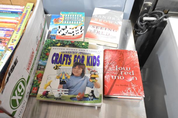 Tier lot including "Crafts for Kids" book, "Seeing Red" by Sandra Brown, "Low Red Moon" by Ivy Devlin, and more.