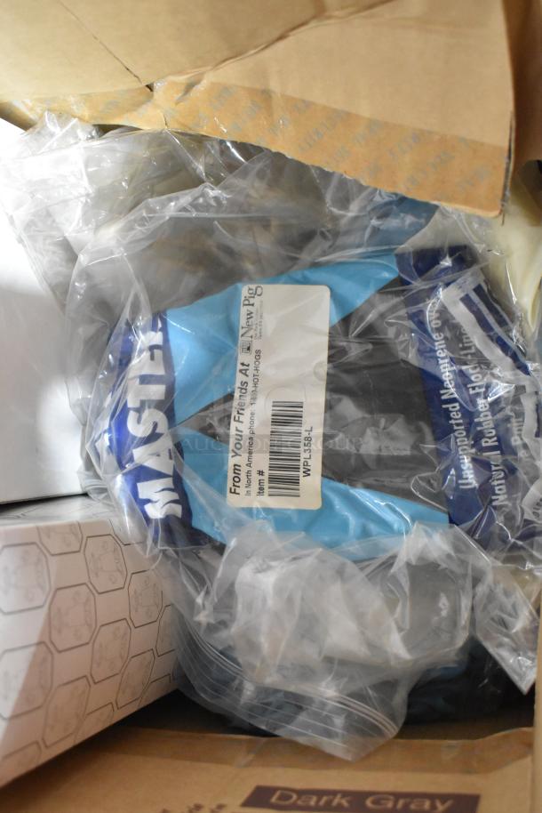 Box of assorted items including packaged gloves labeled "New Pig," cardboard boxes, and a Vornado fan.