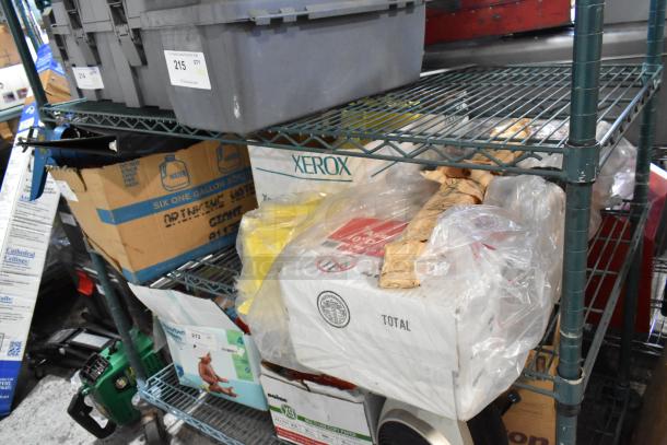 Tiered shelf with assorted items including a caulk gun, binders, Xerox boxes, and jumper cables in used condition.