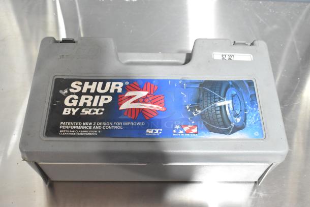 Gray SCC Shur Grip poly tool box, includes tire chains, visible SZ 327 label, made in the USA, lightly worn condition.