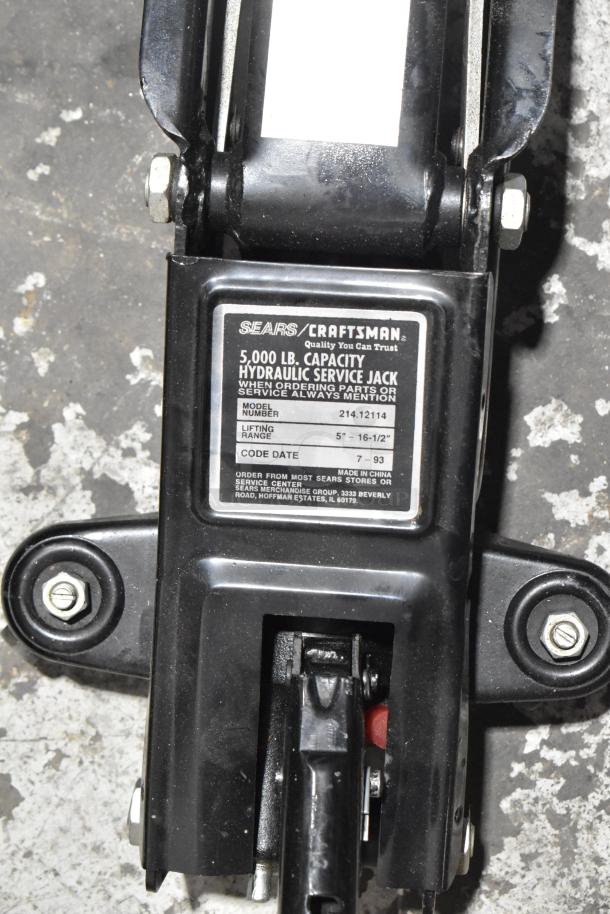 Craftsman 5,000 lb hydraulic service jack, model 214.12114, lifting range 5"-16.5", label visible, good condition.