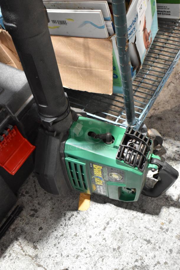 Green Weed Eater with visible engine and handle, stored on a metal wire shelf, part of a three-item auction lot.