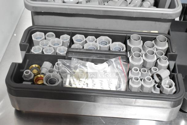 3 gray poly tool boxes with assorted fittings and accessories, neatly organized. Labels visible, good condition.