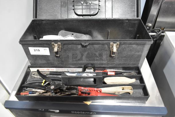 Black Professional Tuff Box Tool Box with assorted contents; features locks, visible label with number 219. Good condition.