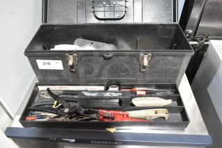 Black Professional Tuff Box Tool Box with assorted contents; features locks, visible label with number 219. Good condition.