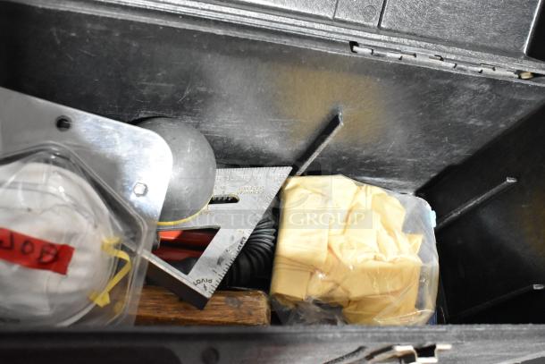 Professional Tuff Box black tool box with contents, including a square, gloves, and mask. Durable and spacious.