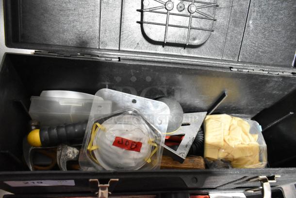 Professional Tuff Box black tool box containing various tools and safety mask with "JOB" label visible, showing organized compartments.