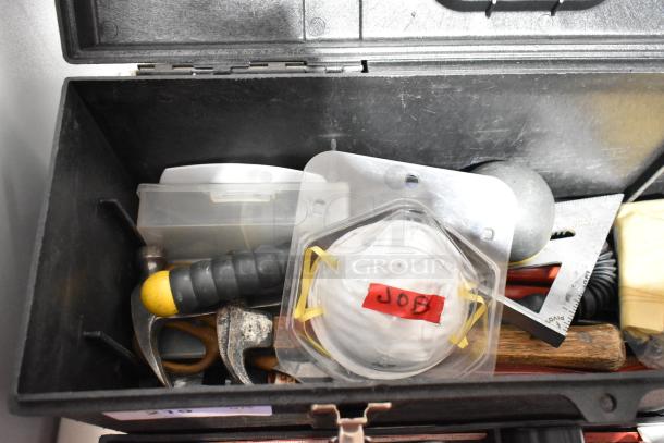 Professional Tuff Box black toolbox with assorted tools and safety mask labeled "Job" inside.
