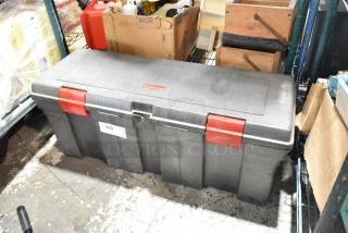 Rubbermaid gray poly tool box with red latches, labeled with logo. Contains contents. Used condition.