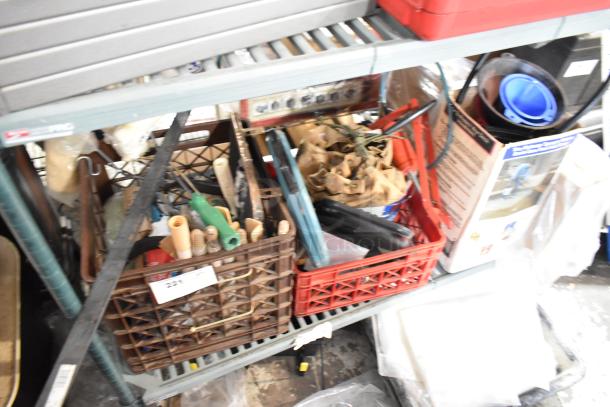 Tiered lot of various items, including tools and a ladder dolly in crates, mixed condition, potential value for buyers.