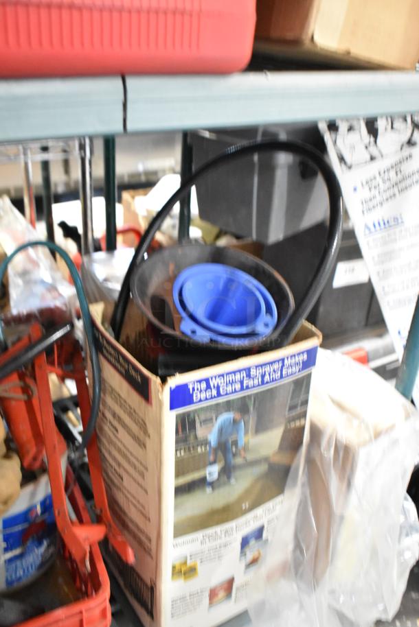Tier lot of various items including a ladder dolly, in mixed condition. Features include a Wolman deck sprayer box and assorted tools.