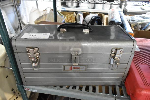 Craftsman gray metal tool box with black handle, dual latches, visible "Craftsman" label, lightly used condition.