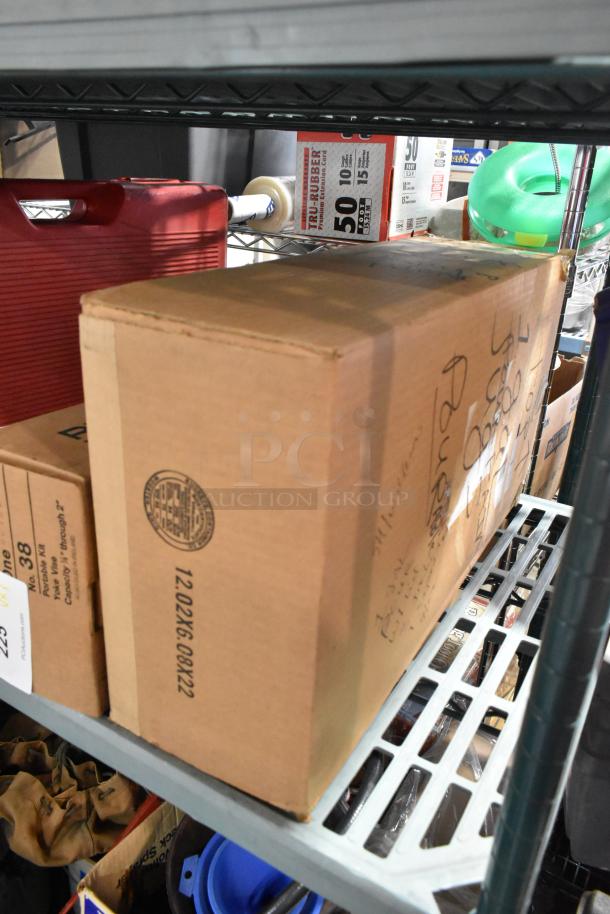 A cardboard box marked with "TRU RUBBER" and shipping details, sitting on a metal shelf alongside other storage items.