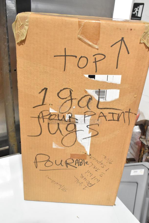 Cardboard box marked "1 gal pour paint jugs, pourable" indicating packaging contents. Sealed with tape.