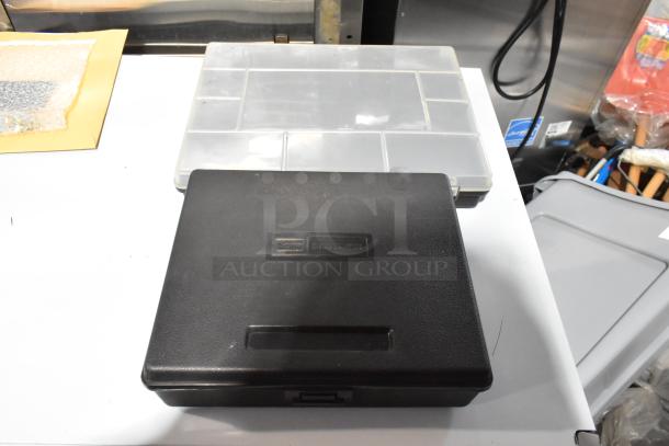 Tiered lot featuring a Rigid 1493 43-60mm tool case and poly bins in good condition.