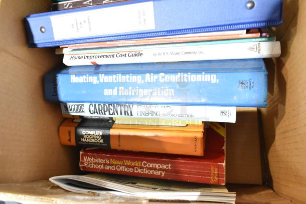 Box of assorted books and binders including titles on carpentry, HVAC, and dictionaries. Used condition.