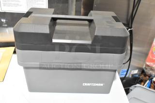 Craftsman gray tool box with black lid. Includes three boxes with contents, featuring the Craftsman logo. Appears in good condition.
