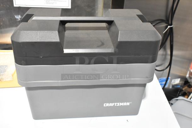 Craftsman gray tool box with handle, showing brand logo, in good condition, includes contents.