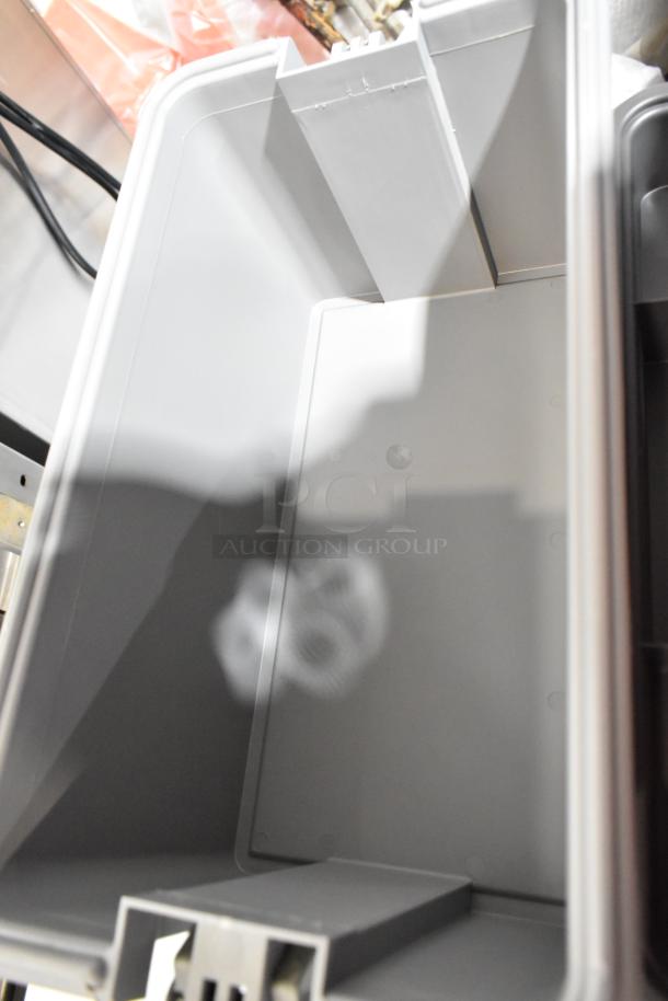 Gray Craftsman tool box, empty, sturdy plastic, interior dividers, good condition, ideal for organizing tools.